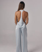 Back view of Paloma light blue satin halter top with open racerback detail styled with matching satin lounge pants in studio.